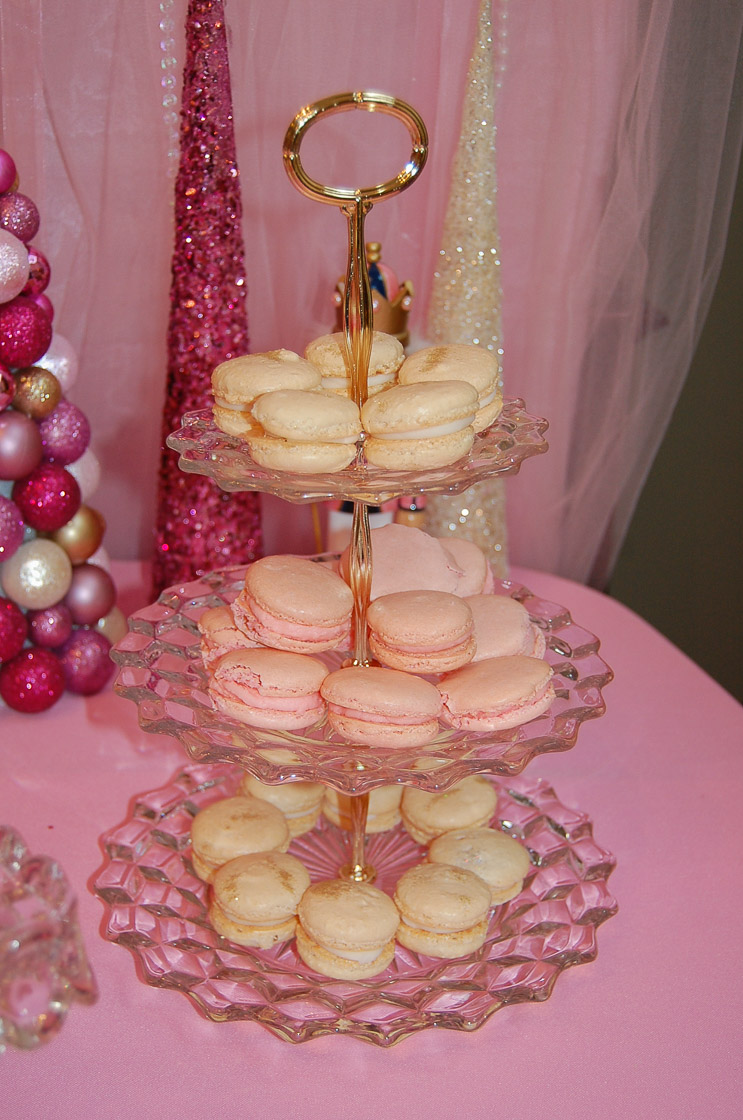pink and white macarons dusted with gold on crystal server