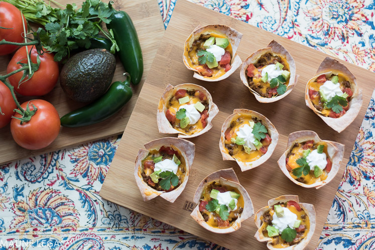 Crunchy taco bowls are filled with yummy, cheesy, gooey goodness. Make these for the big game, your next party, or a fun spin on a staple meal in your home. - Crunchy Taco Bowls Recipe by popular Arkansas lifestyle blogger Maune Legacy