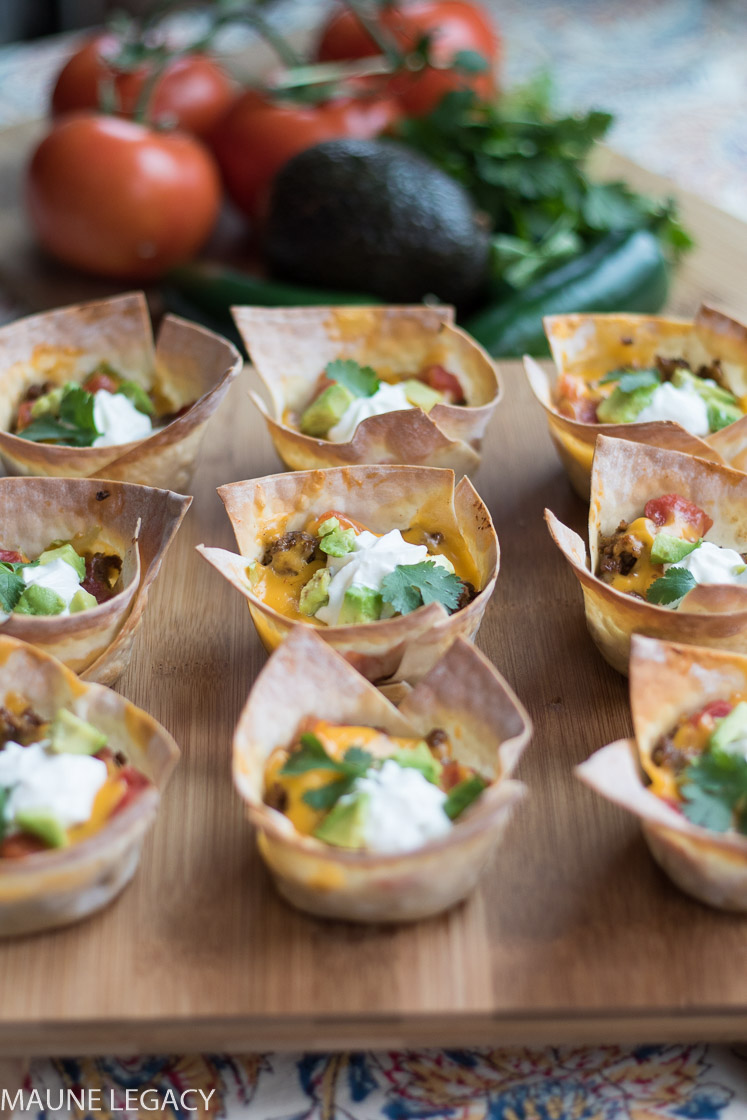 Crunchy taco bowls are filled with yummy, cheesy, gooey goodness. Make these for the big game, your next party, or a fun spin on a staple meal in your home. - Crunchy Taco Bowls Recipe by popular Arkansas lifestyle blogger Maune Legacy