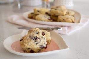 A fun Valentine breakfast idea, this delicious heart shaped cranberry scones recipe renders fluffy, soft scones that are quick and easy to make!