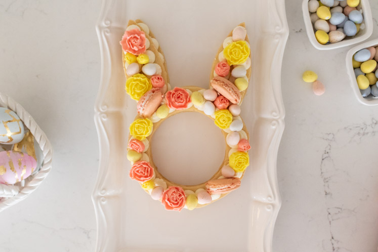 A festive and easy Easter dessert, this Easter Cream Tart Cake Recipe is almost too pretty to eat! With a buttery tart crust and cream buttercream filling, this bunny cream tart is fun to make and perfect for your Easter table!