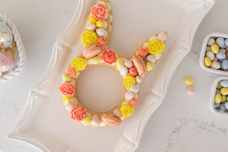 A festive and easy Easter dessert, this Easter Cream Tart Cake Recipe is almost too pretty to eat! With a buttery tart crust and cream buttercream filling, this bunny cream tart is fun to make and perfect for your Easter table!
