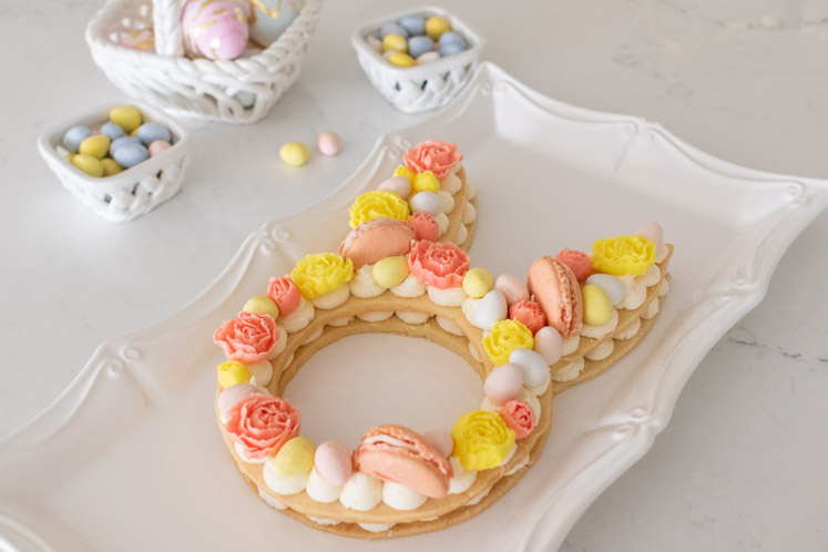 A festive and easy Easter dessert, this Easter Cream Tart Cake Recipe is almost too pretty to eat! With a buttery tart crust and cream buttercream filling, this bunny cream tart is fun to make and perfect for your Easter table!