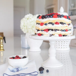 This berry layer cake recipe is light and fluffy layers of chiffon cake, cream, and fresh berries. Make this layer cake for your Mother's Day Brunch, Summer Soiree, or any festive gathering.