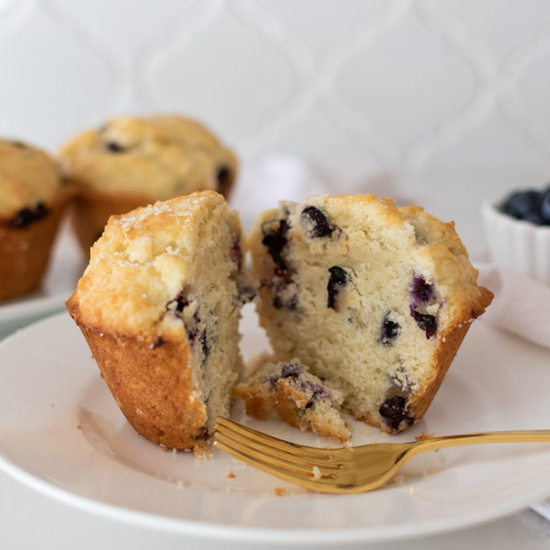 This easy blueberry muffin recipe produces a creamy, fluffy, and soft muffin with a crackly, sugary top. Make these ahead for busy muffins, and enjoy a yummy treat. These homemade blueberry muffins are almost too pretty to eat...almost!