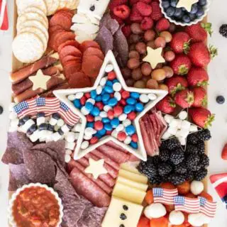 4th of July Patriotic Charcuterie Board This patriotic charcuterie board is perfect for your Fourth of July party food table. Filled with sweet and savory food options, this patriotic snack board includes tips for building your own and a shopping list.