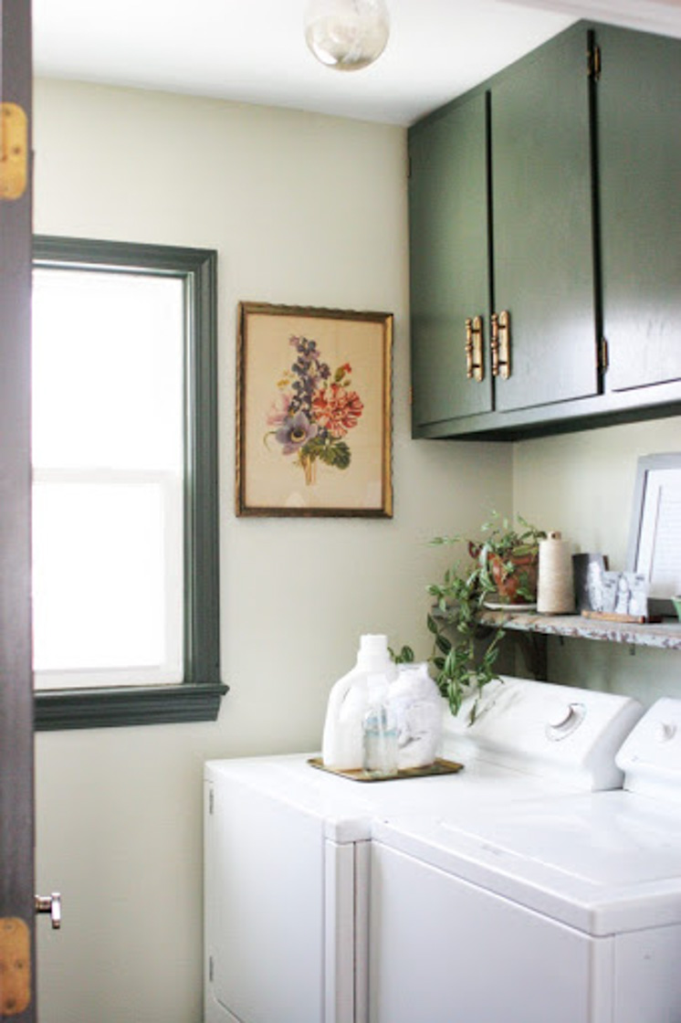 laundry room makeover with painted cabinets and vintage elements