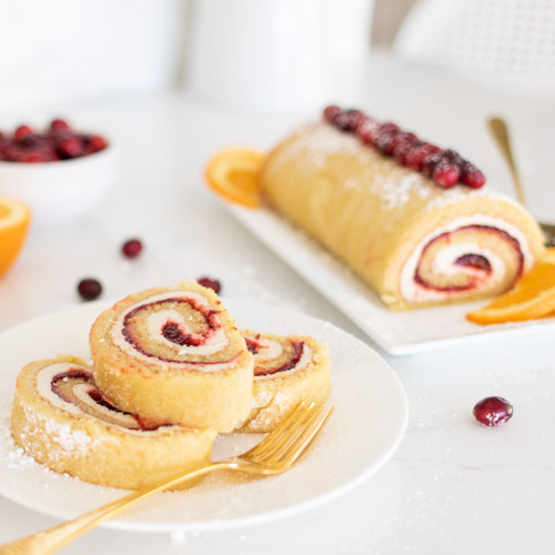 I have 13 of the Best Holiday Appetizers for you including this Cranberry Meringue Roulade that is a perfect combination of cranberry orange and sweet cream. You'll love all of these easy holiday appetizer recipes that can be served at Thanksgiving or Christmas, or any festive occasion!