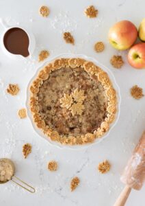 This caramel apple pie recipe is a wonderful spin on your traditional apple pie. Filled with a creamy caramel sauce, cinnamon and sugar, sweet apples, and a streusel topping, this fall pie recipe will be your favorite! Also, check out the 13 Thanksgiving Menu Ideas included to give you all the fall recipe ideas.