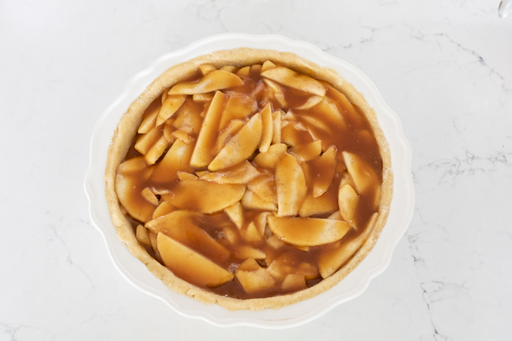 This caramel apple pie recipe is a wonderful spin on your traditional apple pie. Filled with a creamy caramel sauce, cinnamon and sugar, sweet apples, and a streusel topping, this fall pie recipe will be your favorite! Also, check out the 13 Thanksgiving Menu Ideas included to give you all the fall recipe ideas.