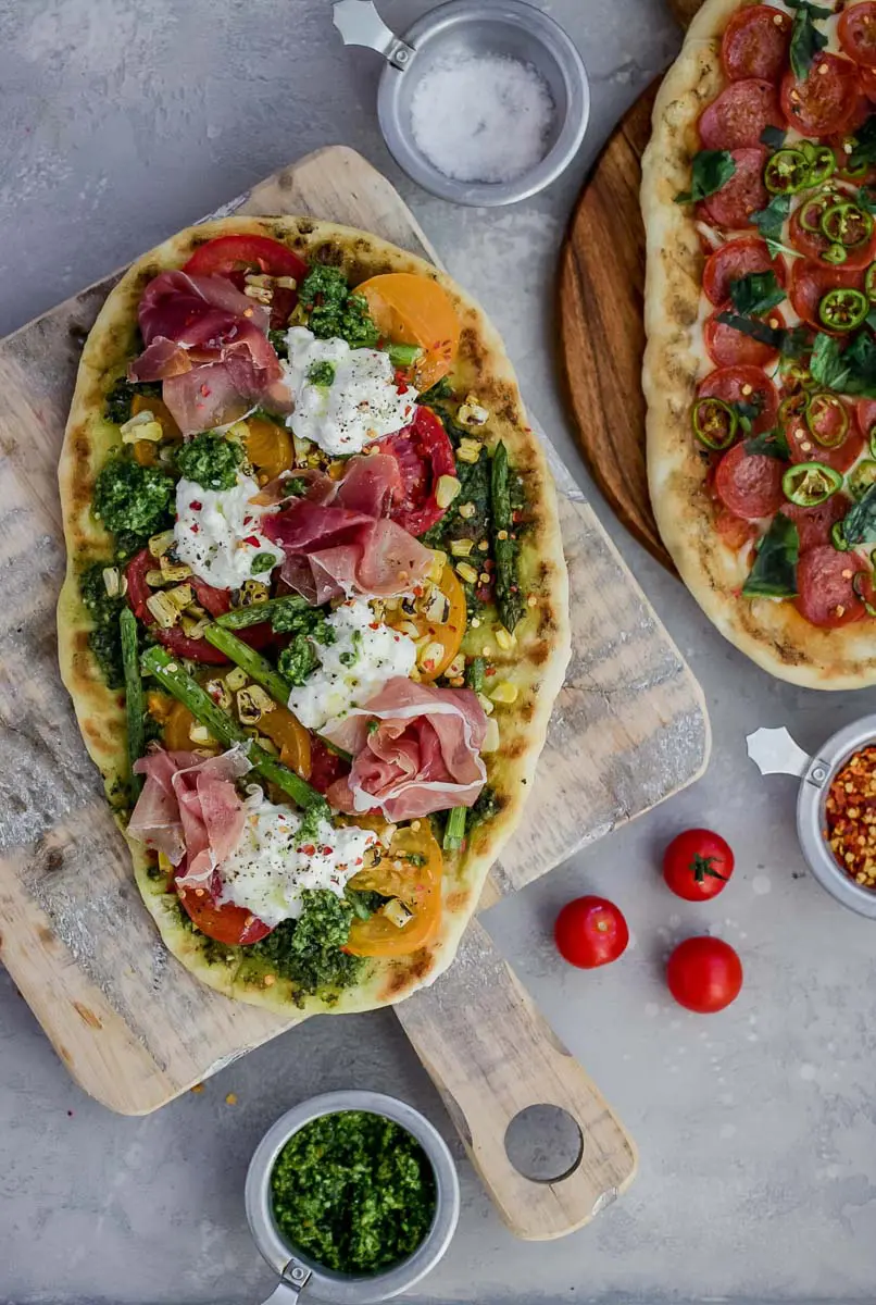 grilled flatbread pizza dough with multiple toppings