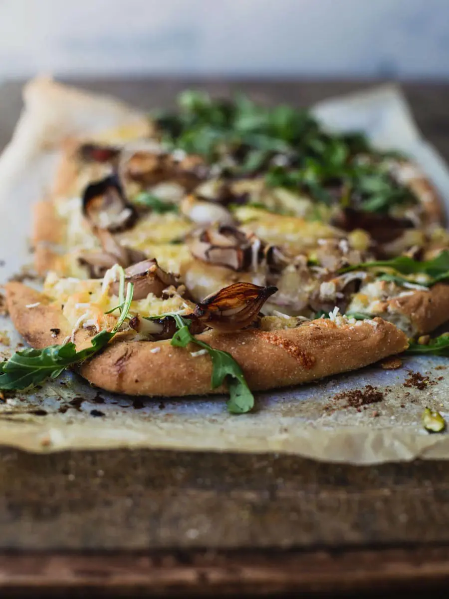 vegan pizza with almond ricotta, balsamic shallots and sweet pears