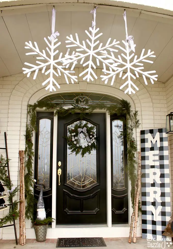 black and white front porch decorated for Christmas