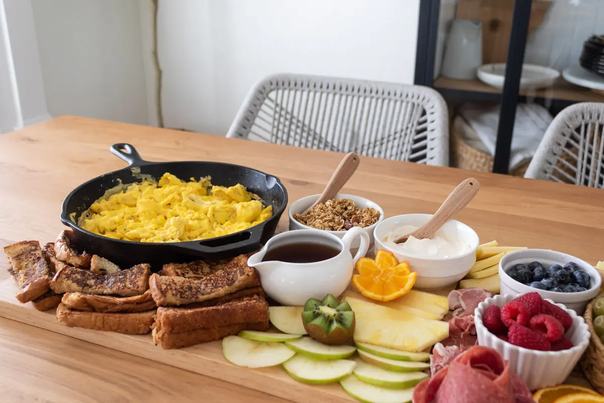 eggs, french toast sticks, apple slices, yogurt, granola